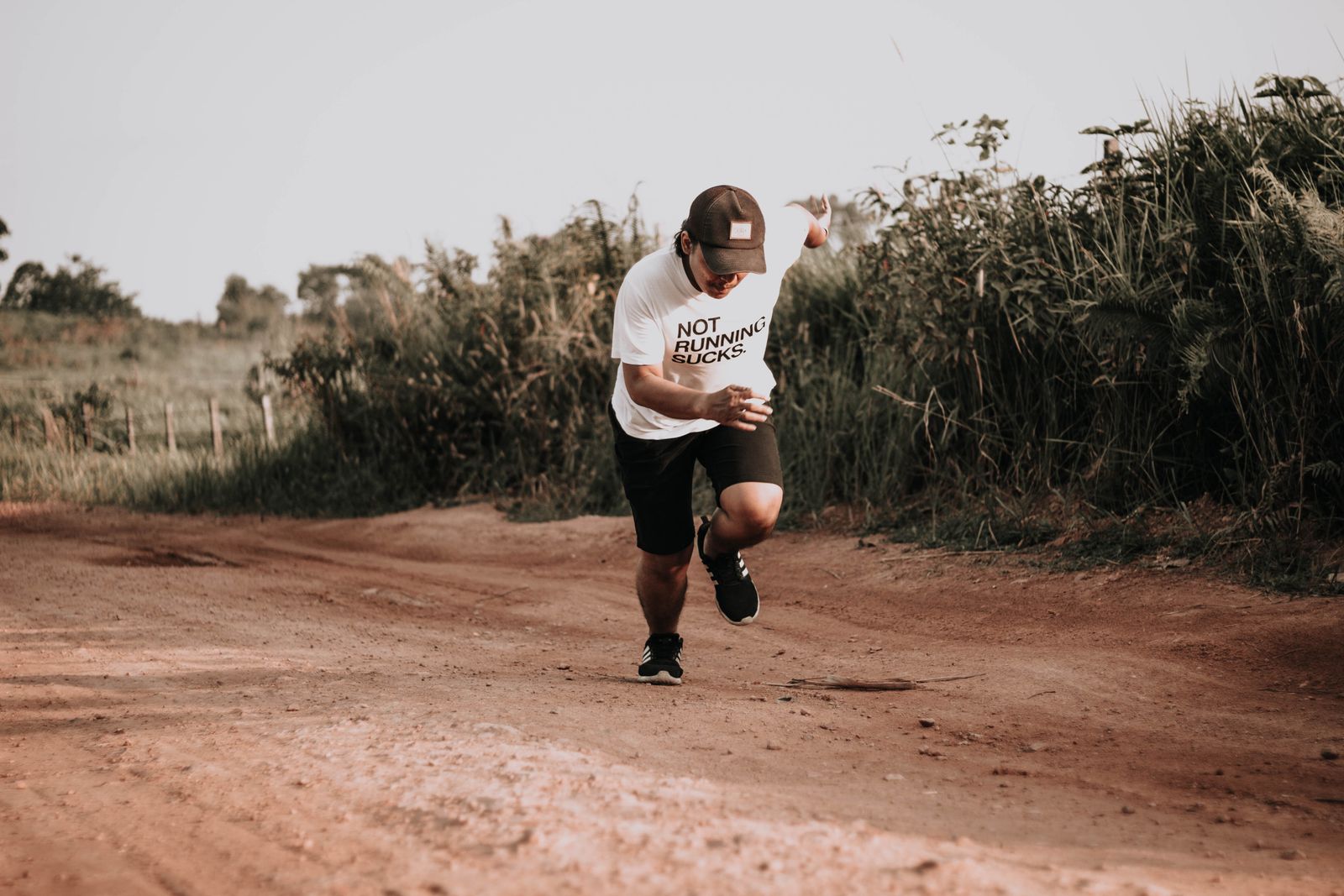Runner on a dirt road training for the Air Force PT test two-mile run